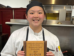 girl holding a plaque